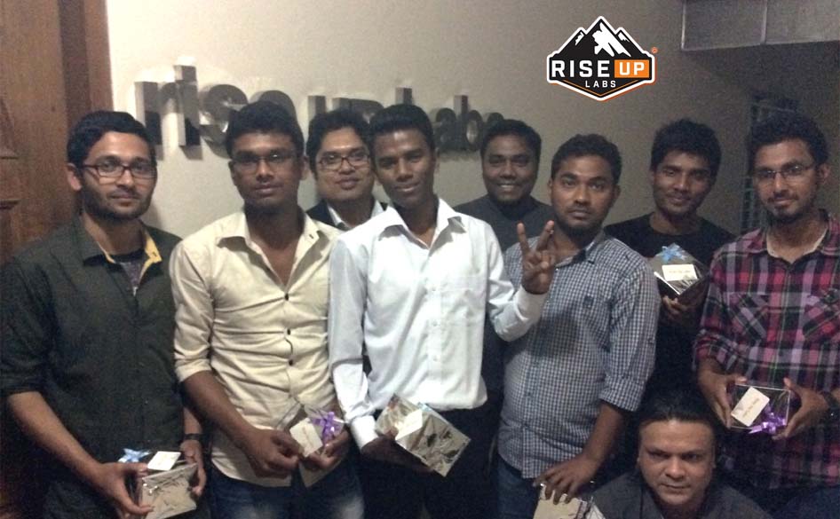 entire team of riseup labs with ceo in front of the office