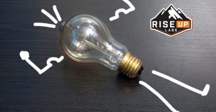 outsourcing shown in the form of an idea as a bulb looking like body builder