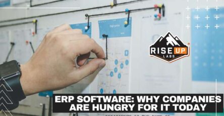 man pinning a map picture on the board